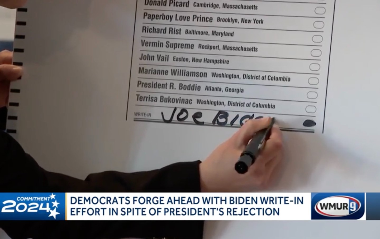 A demonstration of how to write in Joe Biden on the New Hampshire election ballot.